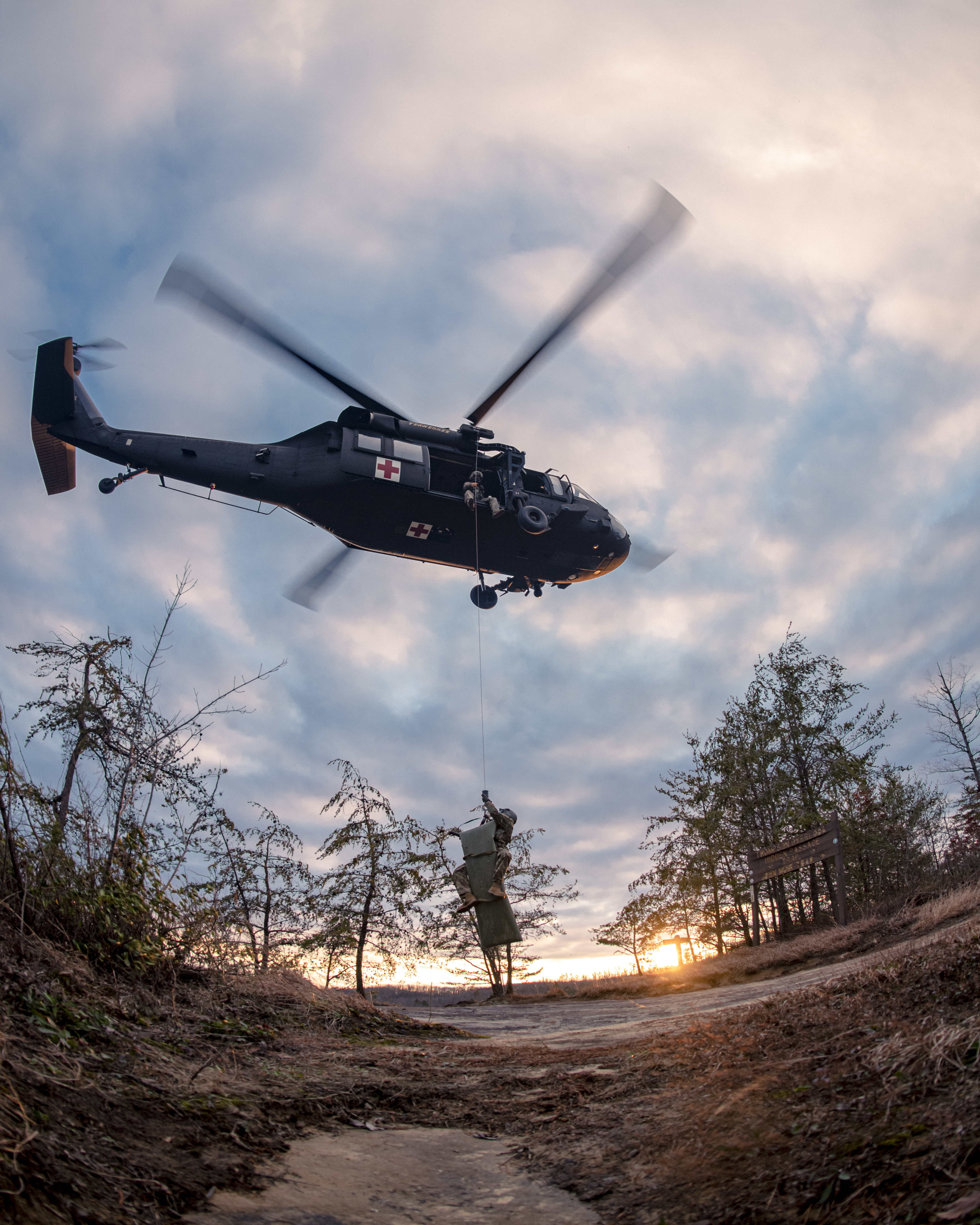 Air crew from 1-230th Assault HelicopterBattalion of Tennessee National Guardconducts casualty hoist exercise as partof SAREX 23 in Pickett State Park nearJamestown, Tennessee, January 7, 2023(U.S. Air National Guard/Ben Cash)